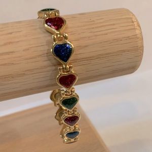 Gold toned bracelet with red, green, blue hearts  7 1/2 inches